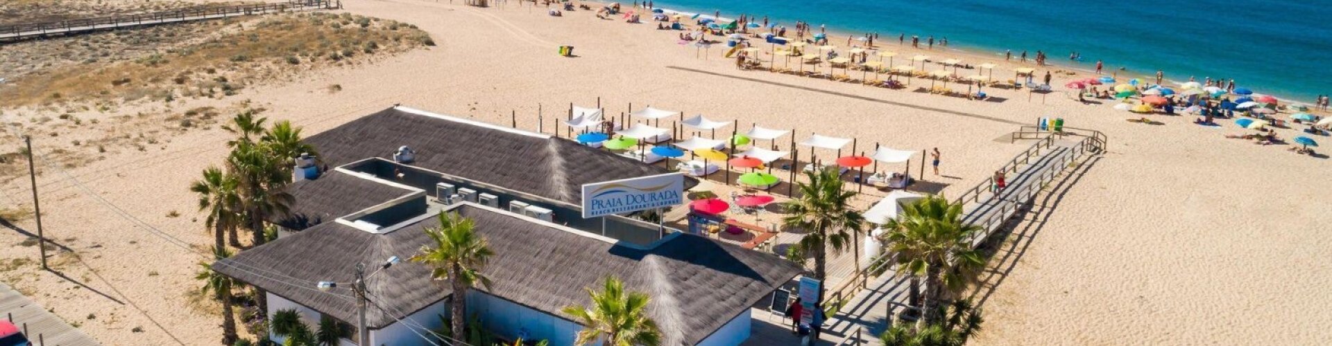 Luxury car overlooking Armacao De Pera coastline