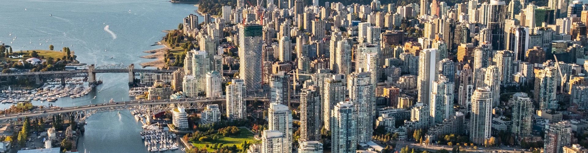 Luxury car parked with Vancouver skyline