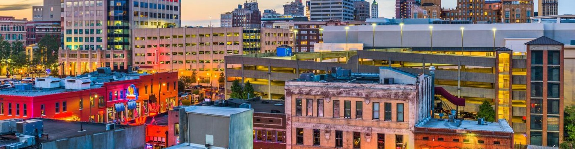 Luxury car on Memphis street at dusk