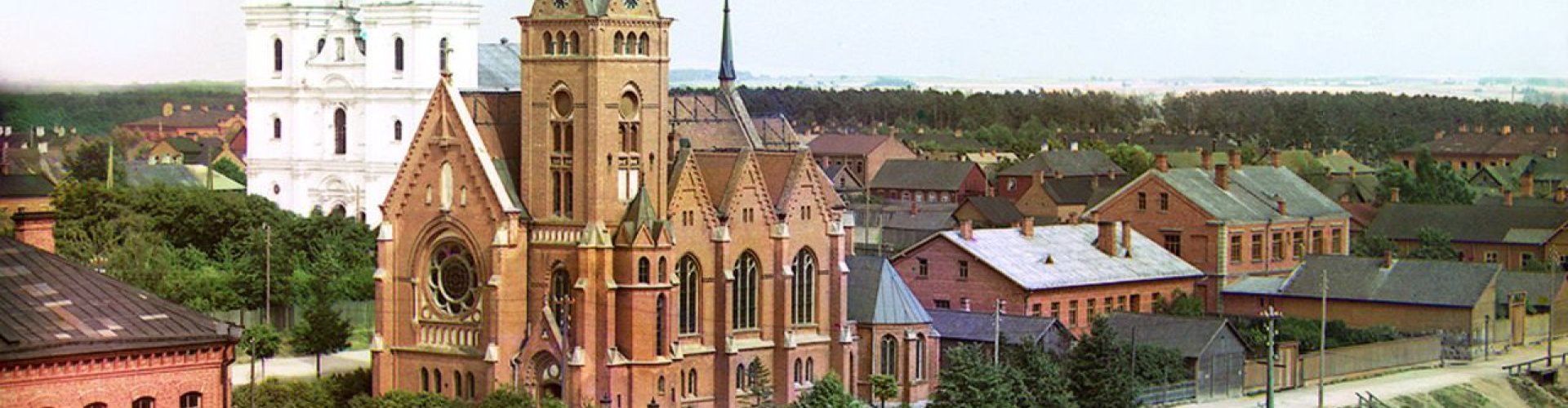 Luxury limousine parked in Daugavpils cityscape at dusk