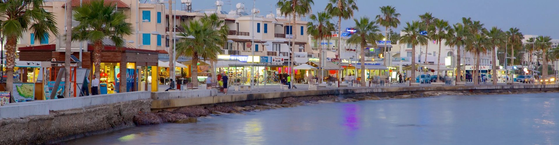 Luxury car driving through Paphos sunset