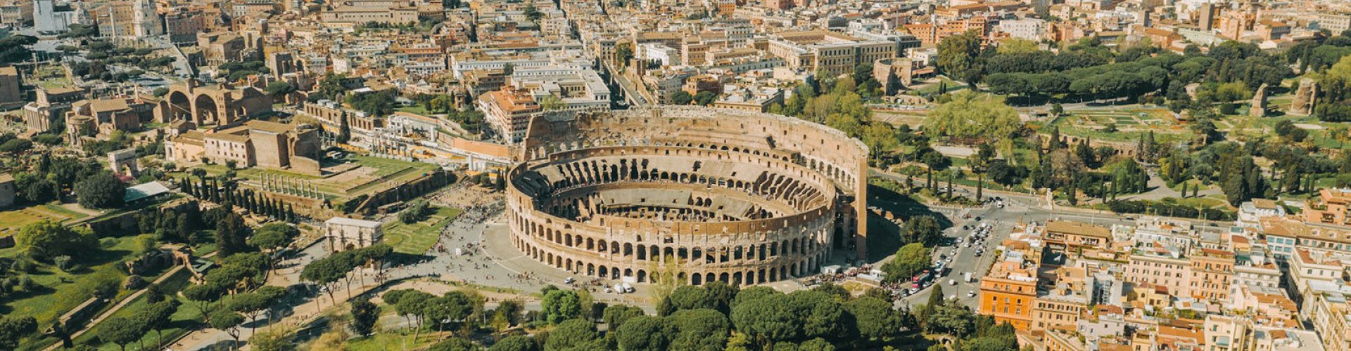 Luxury car parked near Roman landmark