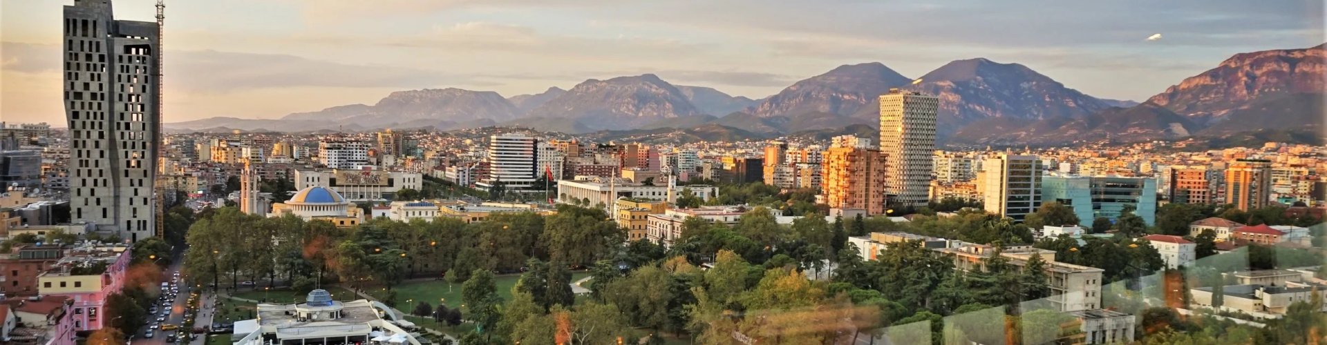 Luxury limousine in Tirana cityscape