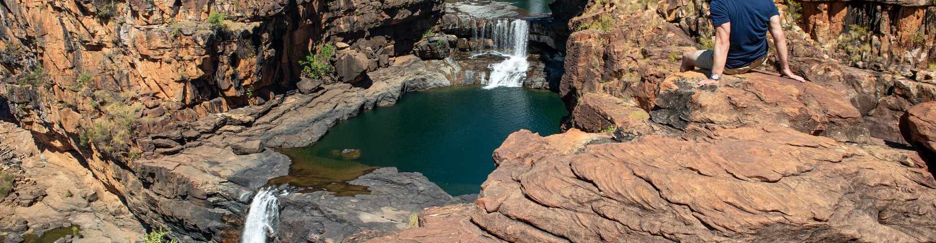 Luxury limousine cruising Kimberley cityscape