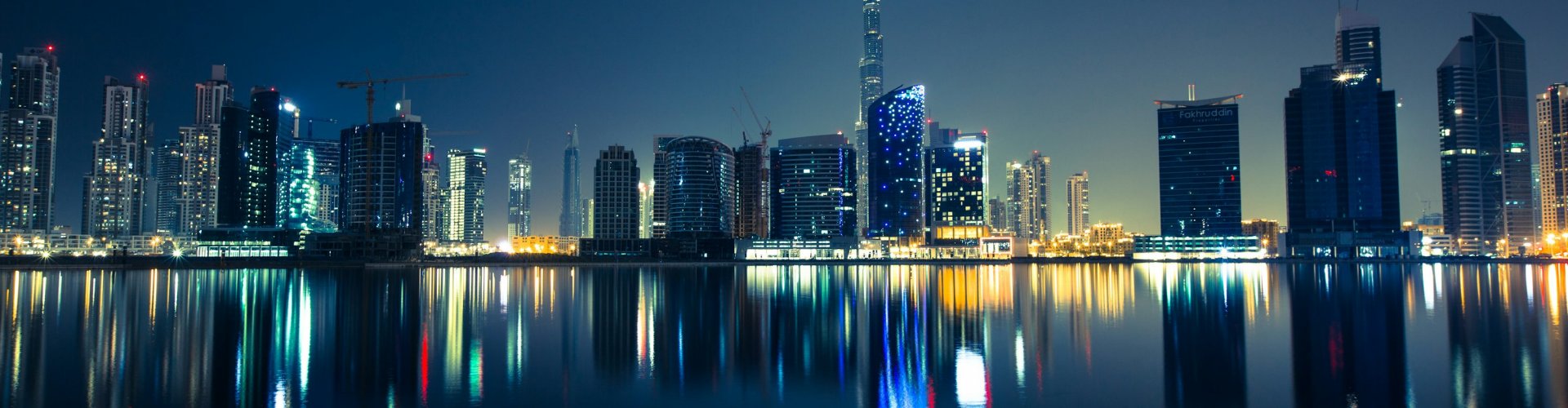 Luxury car overlooking Dubai skyline