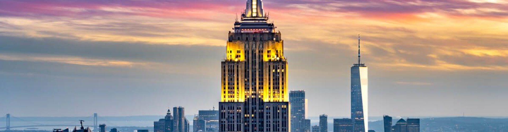 Luxury car parked with New York skyline